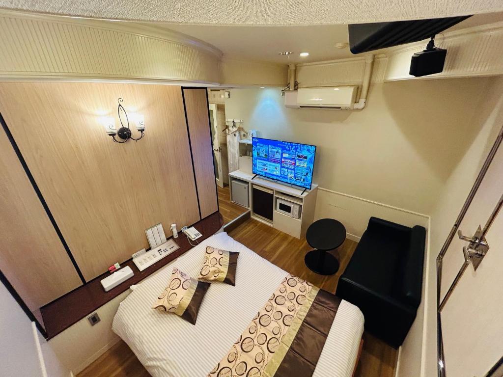 TV a/nebo společenská místnost v ubytování Hotel Crystal -adult only-