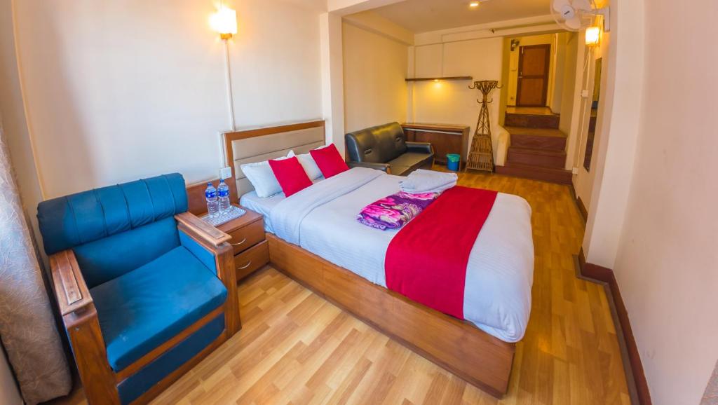 Postel nebo postele na pokoji v ubytování Durbar Guest House
