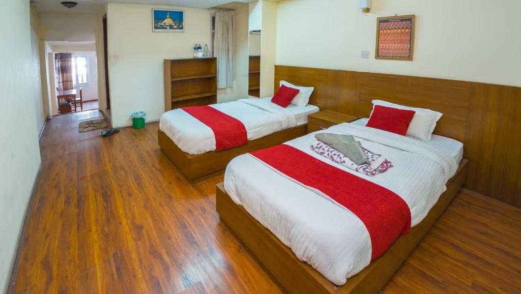 Postel nebo postele na pokoji v ubytování Durbar Guest House