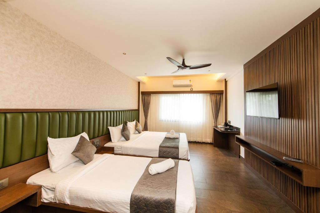 TV a/nebo společenská místnost v ubytování Hotel Mysore Radiance