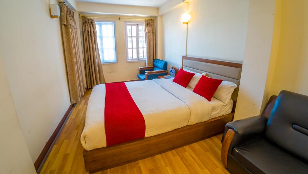 Postel nebo postele na pokoji v ubytování Durbar Guest House