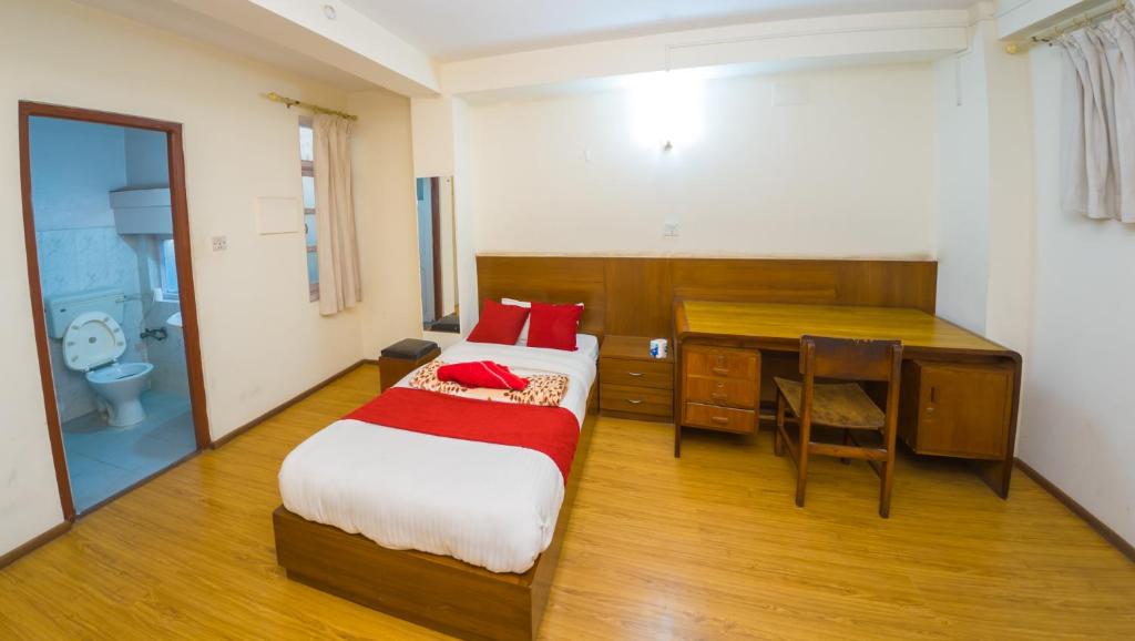 Postel nebo postele na pokoji v ubytování Durbar Guest House