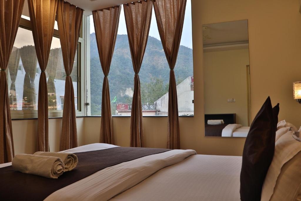 Letto o letti in una camera di Shiv Shakti Hostel