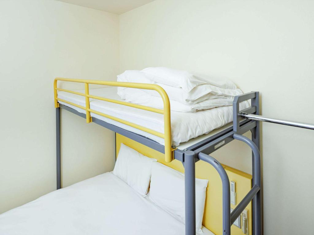 Postel nebo postele na pokoji v ubytování Comfort Inn Suwa Inter