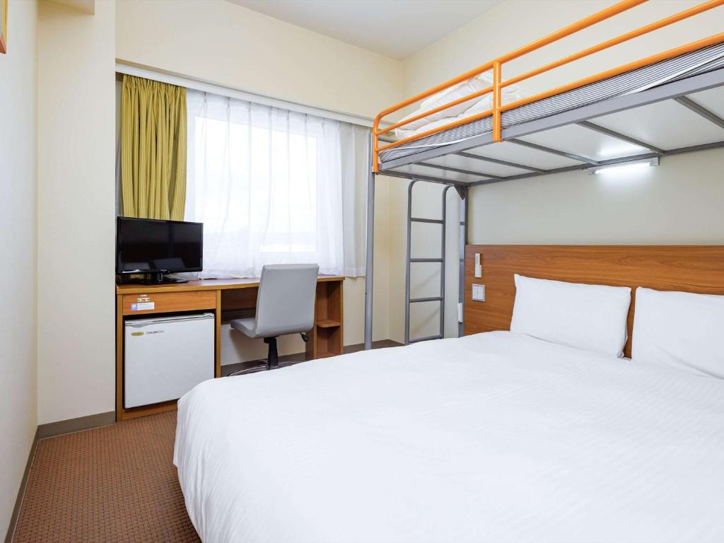 Postel nebo postele na pokoji v ubytování Comfort Inn Tsuchiura Ami