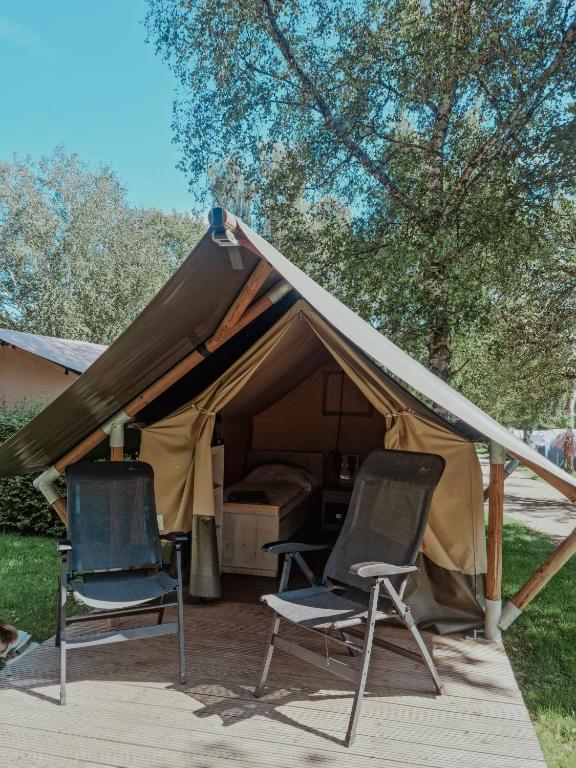 two chairs sitting in front of a tent at Safari tent XS - Camping Belle-Vue in Berdorf
