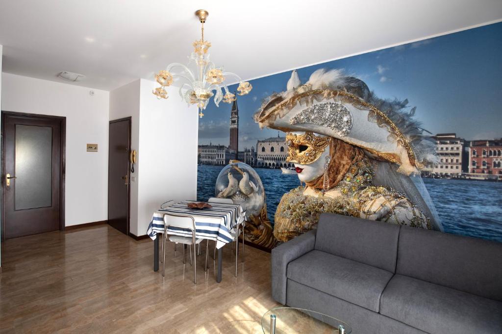 a living room with a large painting on the wall at Martina 2 in Marghera