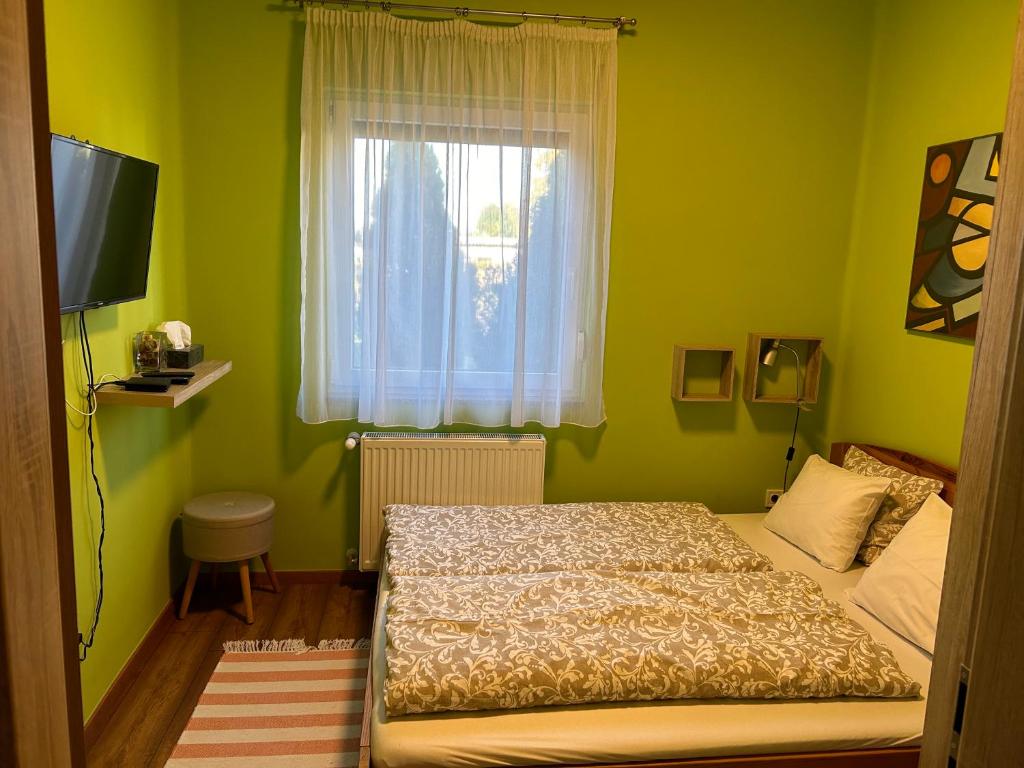 Postel nebo postele na pokoji v ubytování Galéria deluxe apartman