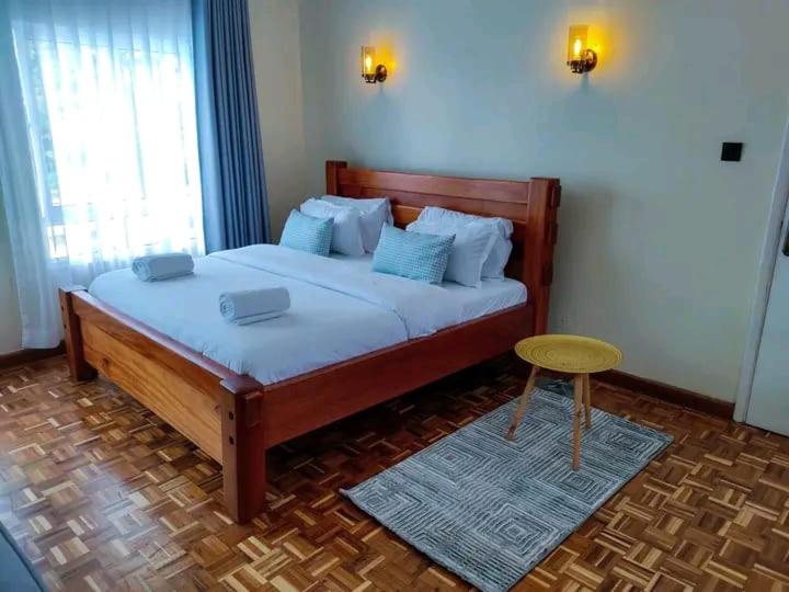 Ένα ή περισσότερα κρεβάτια σε δωμάτιο στο Kivulini Eco-Park Karen