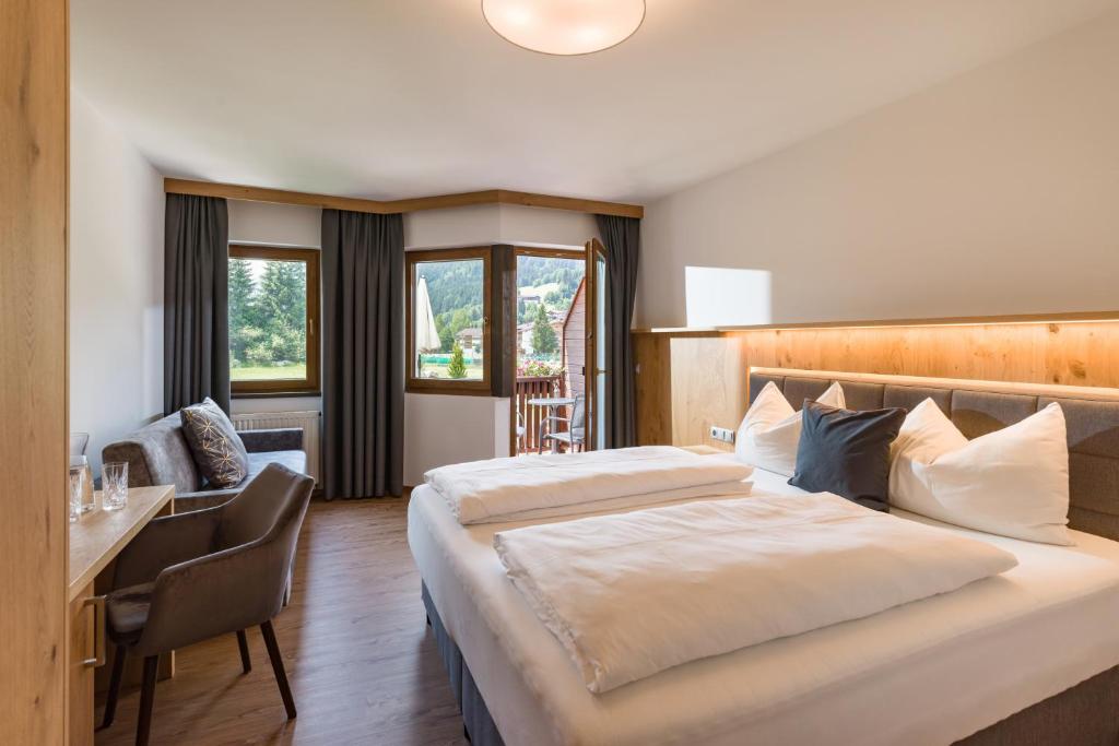Postel nebo postele na pokoji v ubytování Hotel Kroneck