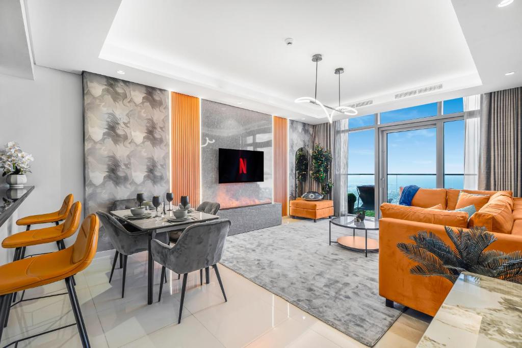 a living room with a table and a couch at 64th floor Skyline Pool with Burj Khalifa View in Paramount Hotel Midtown in Dubai