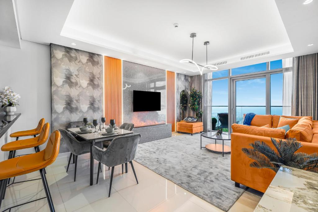 a living room with a table and a couch at 64th floor Skyline Pool with Burj Khalifa View in Paramount Hotel Midtown in Dubai