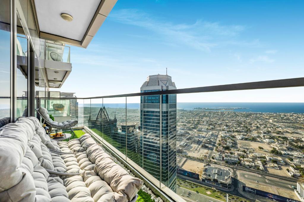 a view of a city from the observation deck of a skyscraper at 64th floor Skyline Pool with Burj Khalifa View in Paramount Hotel Midtown in Dubai
