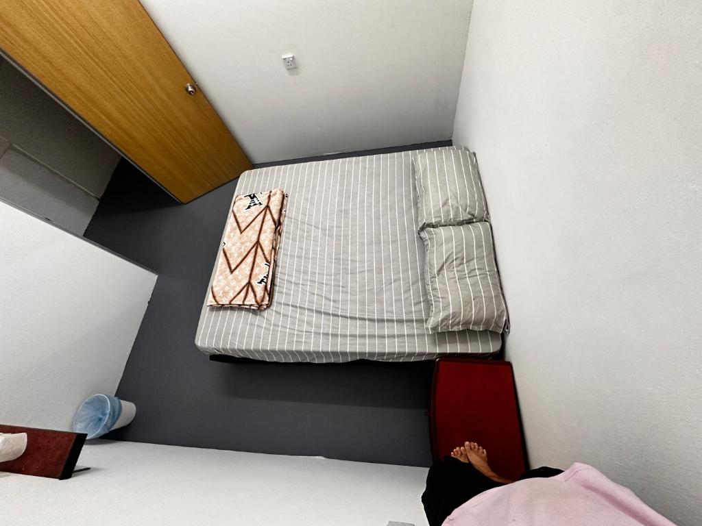 Voodi või voodid majutusasutuse Jiaxin Dormitory - Puteri Wangsa 家馨旅舍 toas