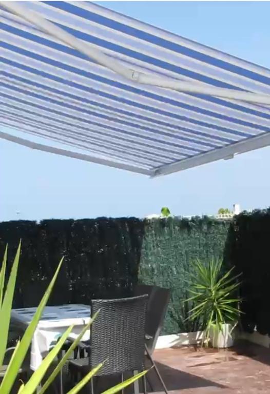 Balkón nebo terasa v ubytování CALA HOUSE II Luminoso adosado con vistas,piscina comunitaria y parking incluido
