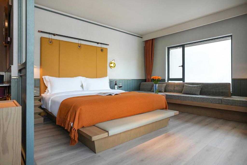 Postel nebo postele na pokoji v ubytování Shenzhen Xili Ruixi Hotel