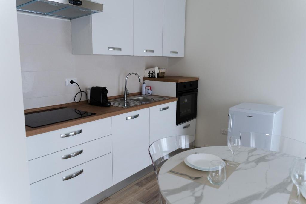 Kuchyň nebo kuchyňský kout v ubytování ComfortHome Fiera