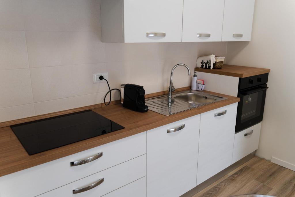 Kuchyň nebo kuchyňský kout v ubytování ComfortHome Fiera