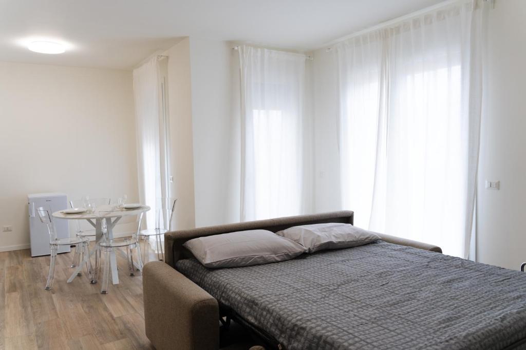 Postel nebo postele na pokoji v ubytování ComfortHome Fiera