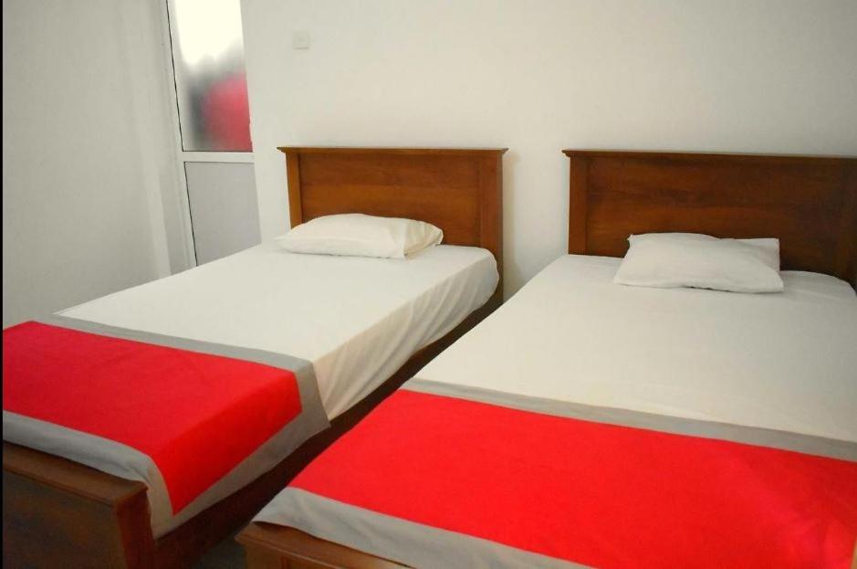 Postel nebo postele na pokoji v ubytování Punchi Walawwa - Guest House - Holiday Bungalow