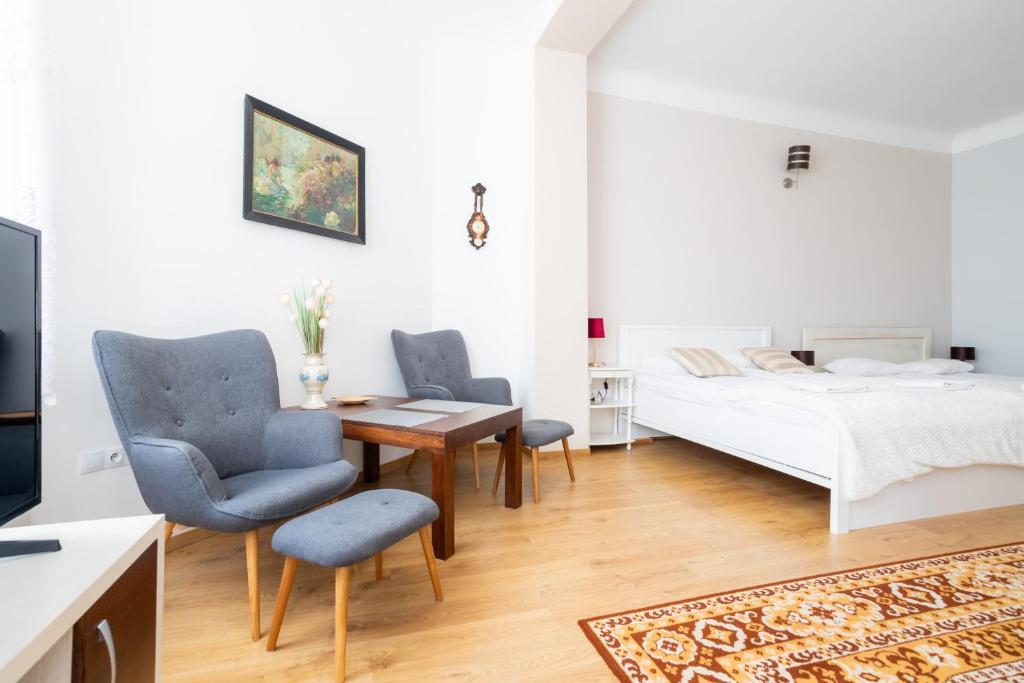 Posteľ alebo postele v izbe v ubytovaní Victus Apartamenty, Apartament Harmony