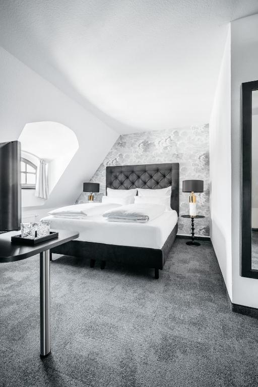 Ein Bett oder Betten in einem Zimmer der Unterkunft Hotel Riesengebirge