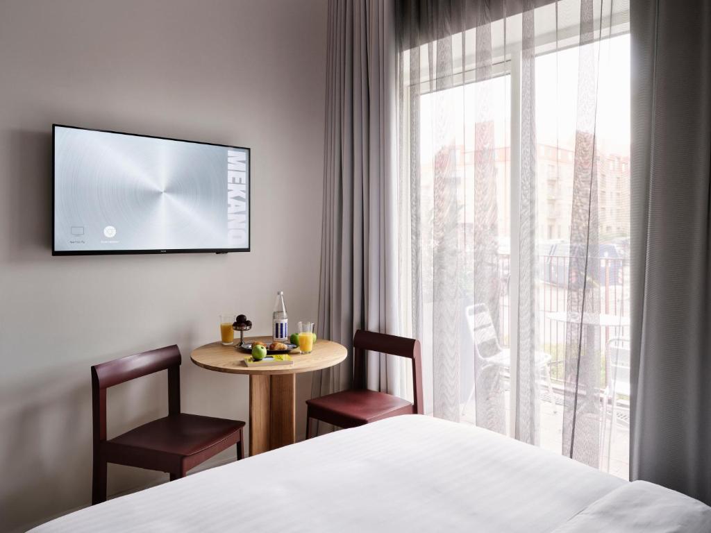 Postel nebo postele na pokoji v ubytování Mekano Apartment Hotel