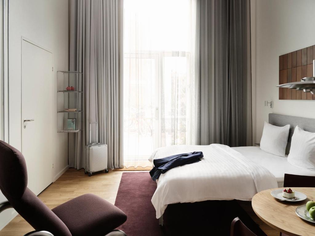 Postel nebo postele na pokoji v ubytování Mekano Apartment Hotel