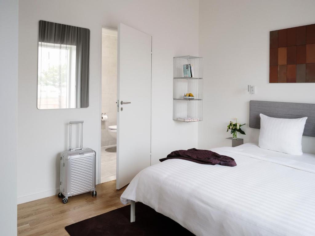 Postel nebo postele na pokoji v ubytování Mekano Apartment Hotel