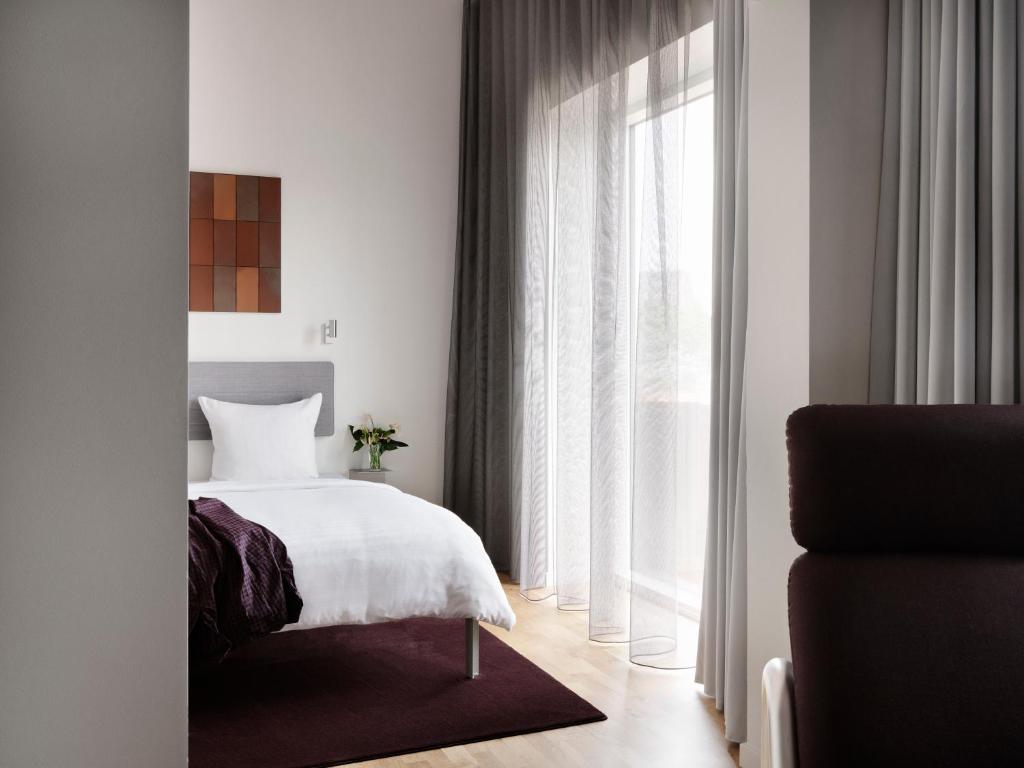 Postel nebo postele na pokoji v ubytování Mekano Apartment Hotel