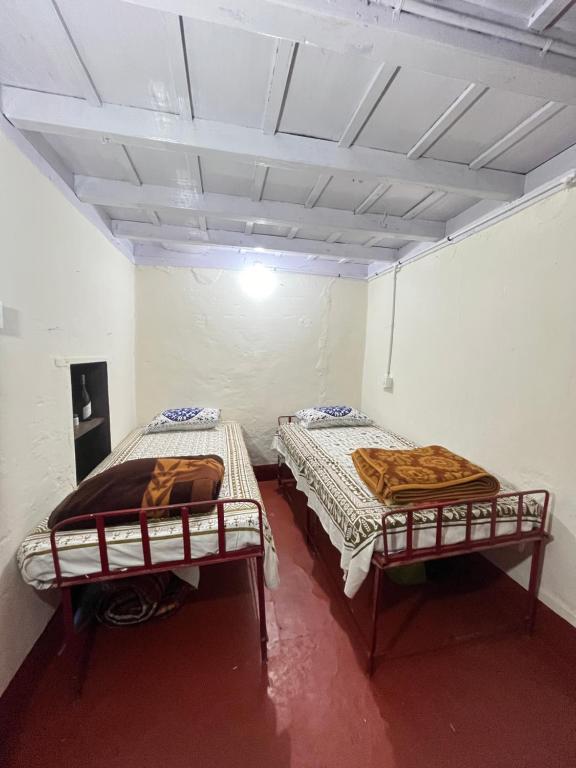 Postel nebo postele na pokoji v ubytování TauSco Homestay & Campsite - Coorg