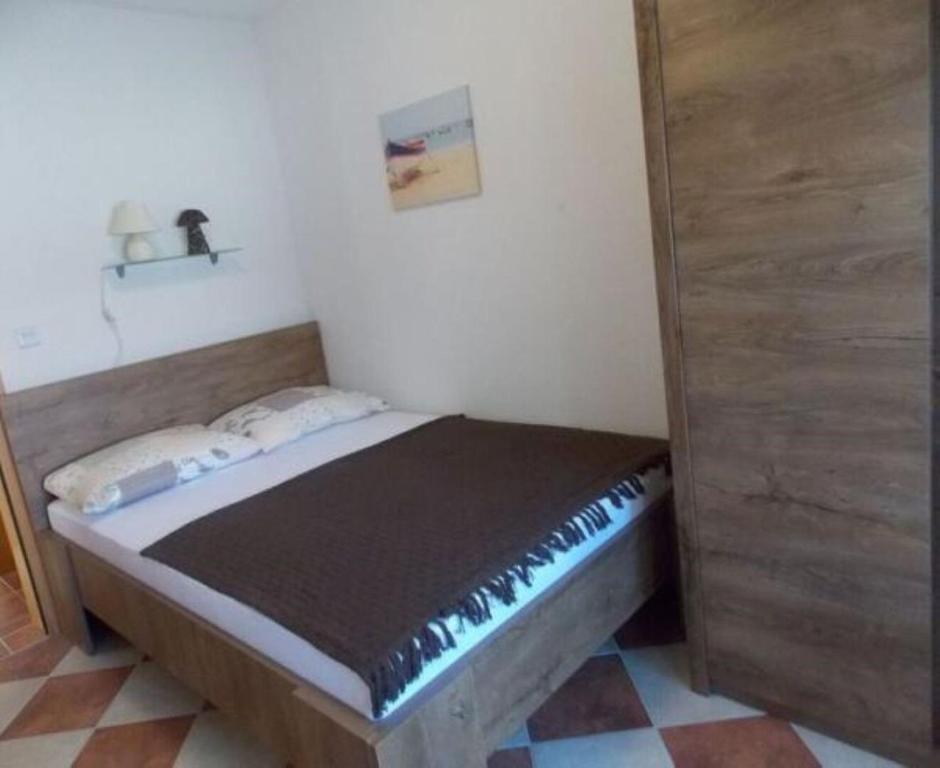Posteľ alebo postele v izbe v ubytovaní Apartments Sanja