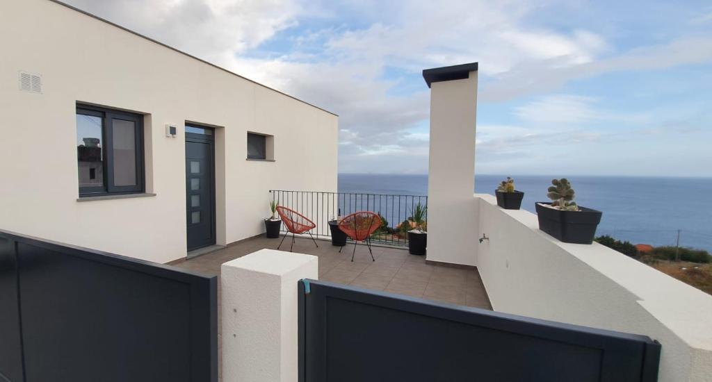 a balcony with a view of the ocean at Sea&Sunrise Village in Caniço