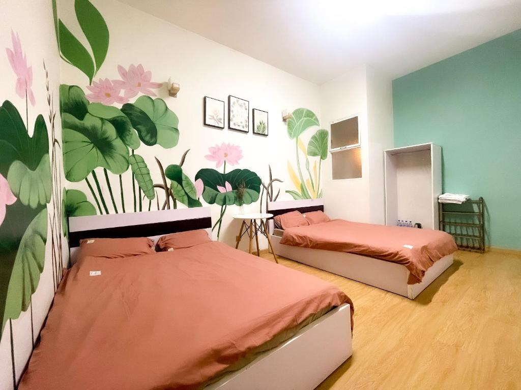 Postel nebo postele na pokoji v ubytování Xenia Đà Lạt 2