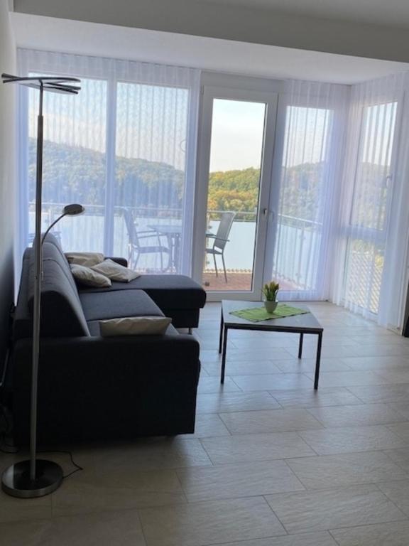 a living room with a couch and a table at Appartement 17 in Oerlinghausen