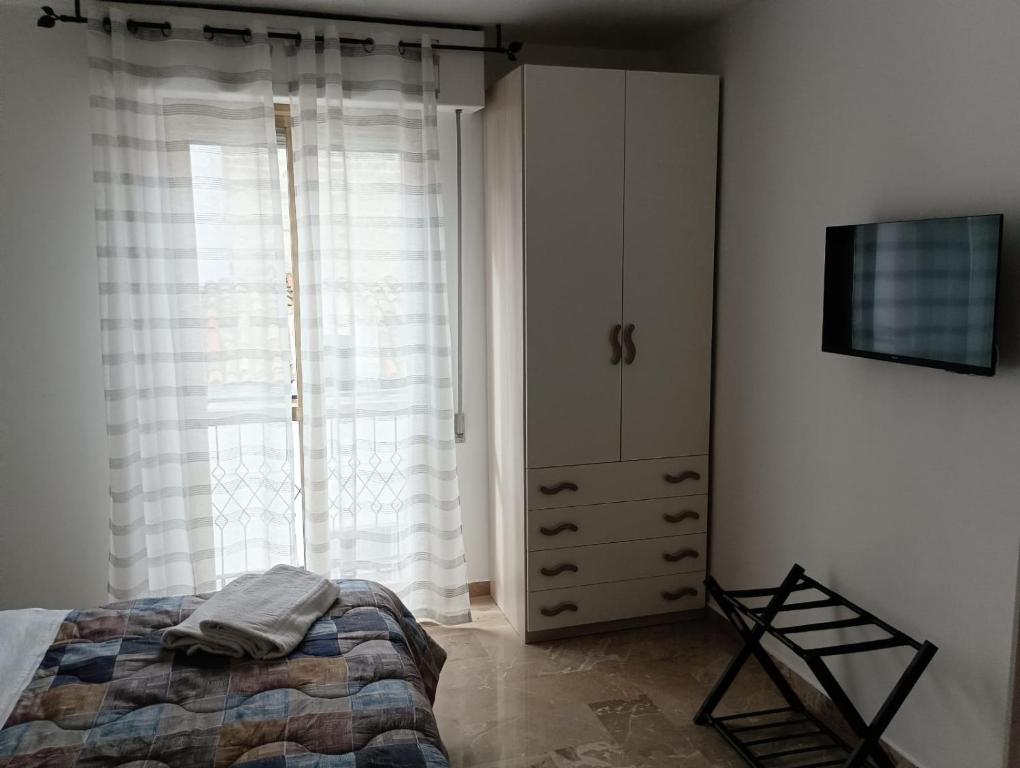 Postel nebo postele na pokoji v ubytování A casa di Elena e Francesco