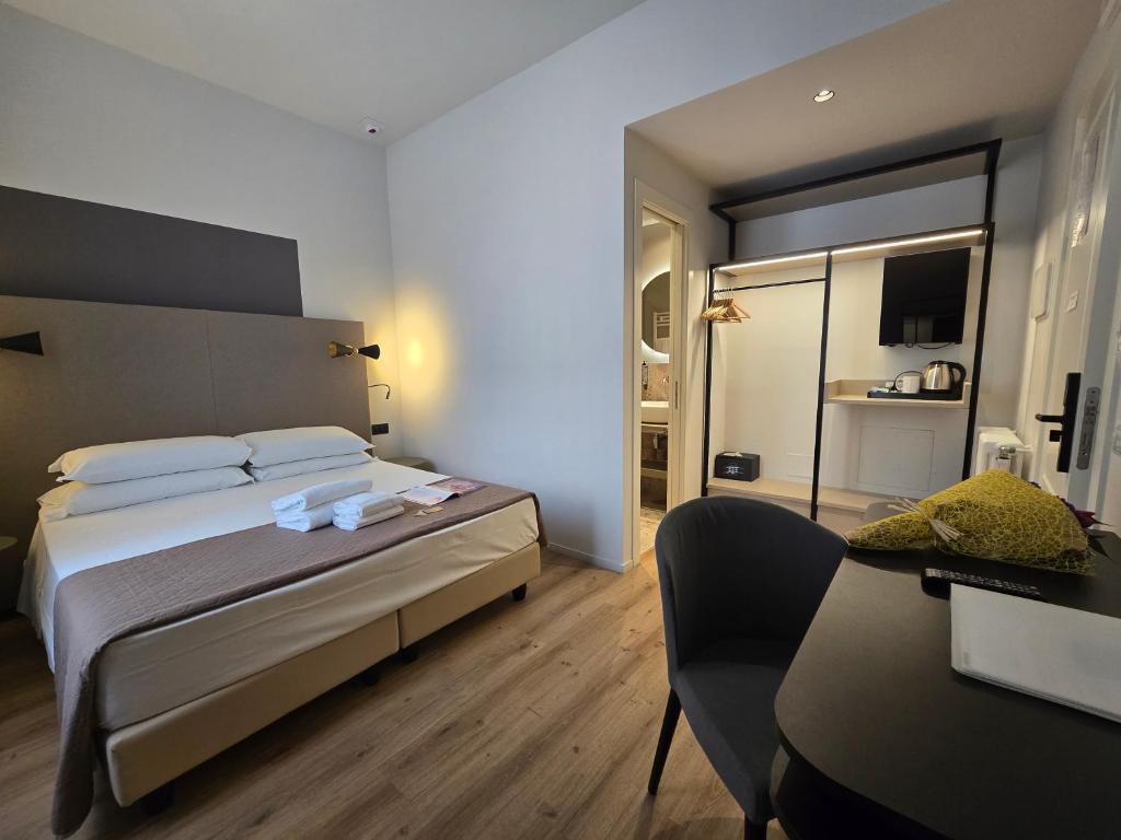 Postel nebo postele na pokoji v ubytování Hotel Porta Pia