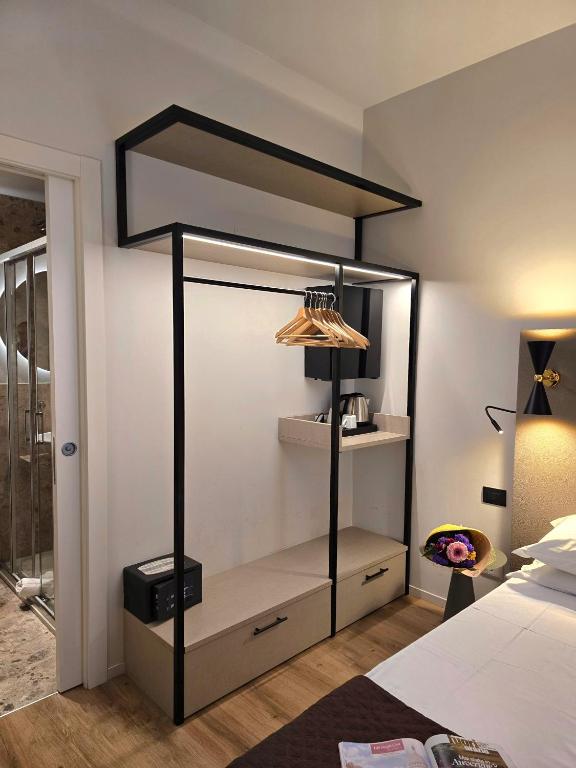 Postel nebo postele na pokoji v ubytování Hotel Porta Pia
