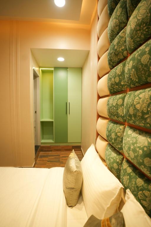 Cama o camas de una habitación en Dashrath Inn near Ramjanmbhoomi