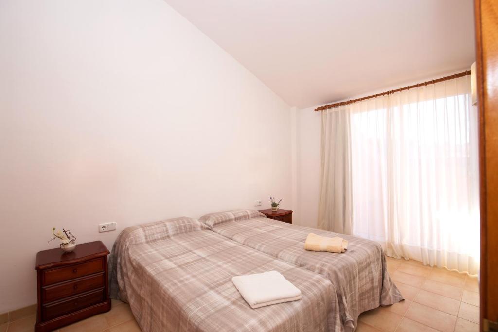 Postel nebo postele na pokoji v ubytování Apartaments Sa Guilla