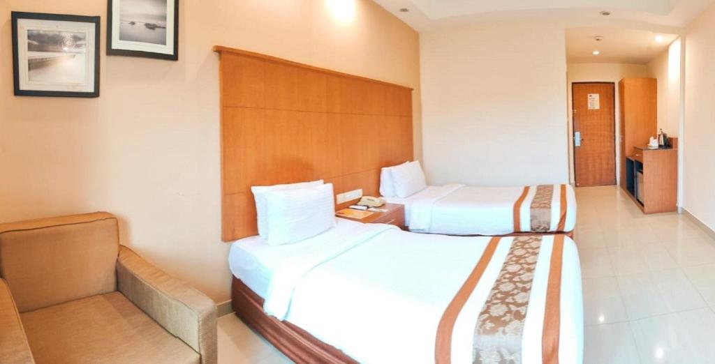 Postel nebo postele na pokoji v ubytování La Franklin Hotel
