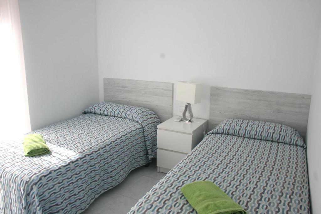 Postel nebo postele na pokoji v ubytování Apartaments Sa Guilla
