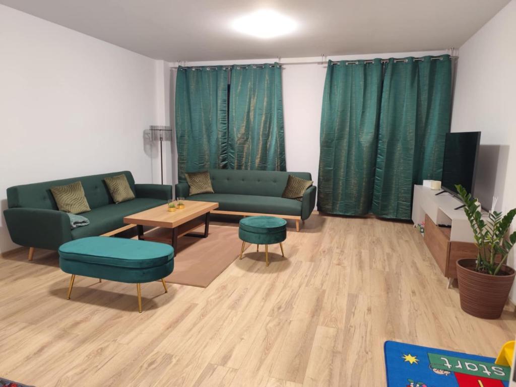 a living room with a couch and a table at Franco Piešťany Apartments 2 in Piešťany
