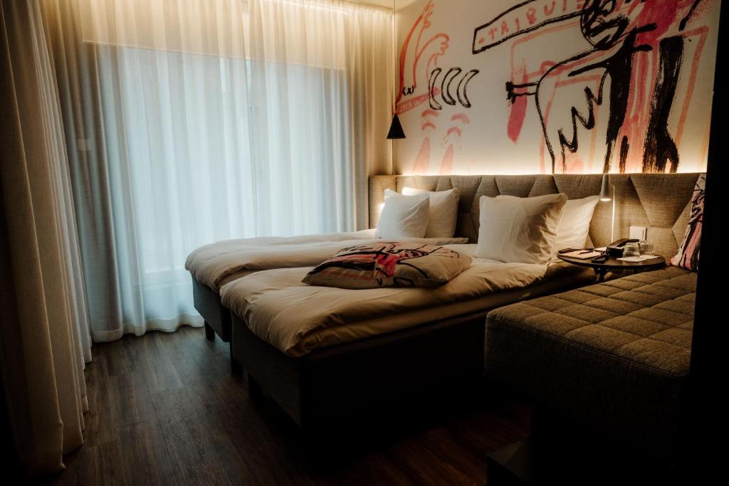 Ένα ή περισσότερα κρεβάτια σε δωμάτιο στο Hotel AX