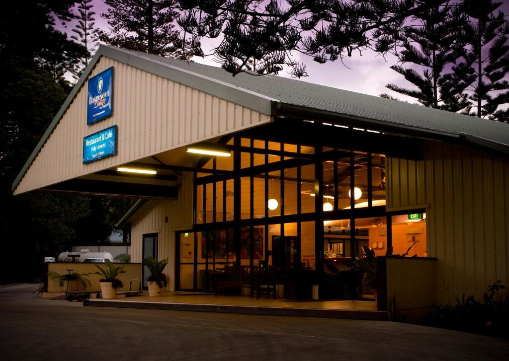 a building with a sign on the side of it at Governors Lodge Resort Hotel in Burnt Pine