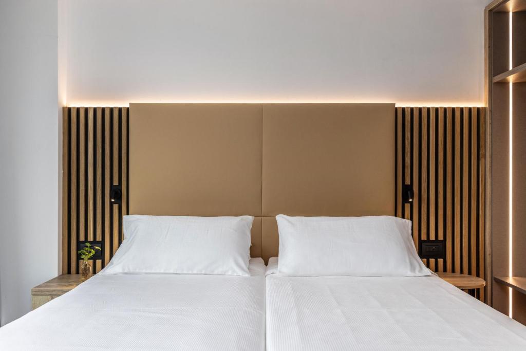 Postel nebo postele na pokoji v ubytování Garda Suite Hotel - Tonelli Hotels