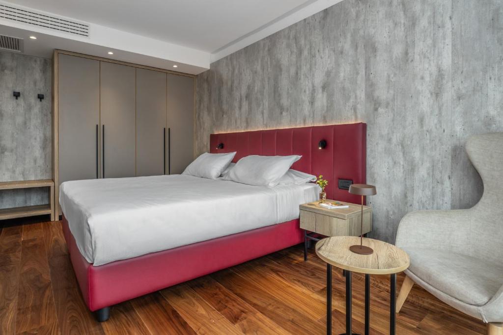 Postel nebo postele na pokoji v ubytování Garda Suite Hotel - Tonelli Hotels