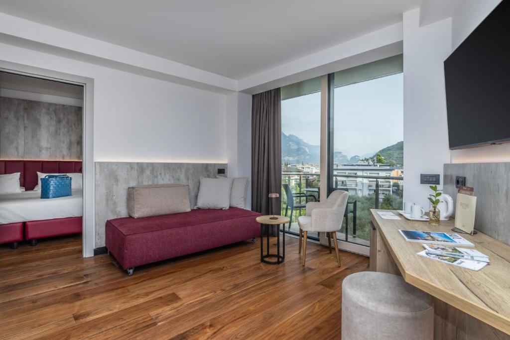 Postel nebo postele na pokoji v ubytování Garda Suite Hotel - Tonelli Hotels
