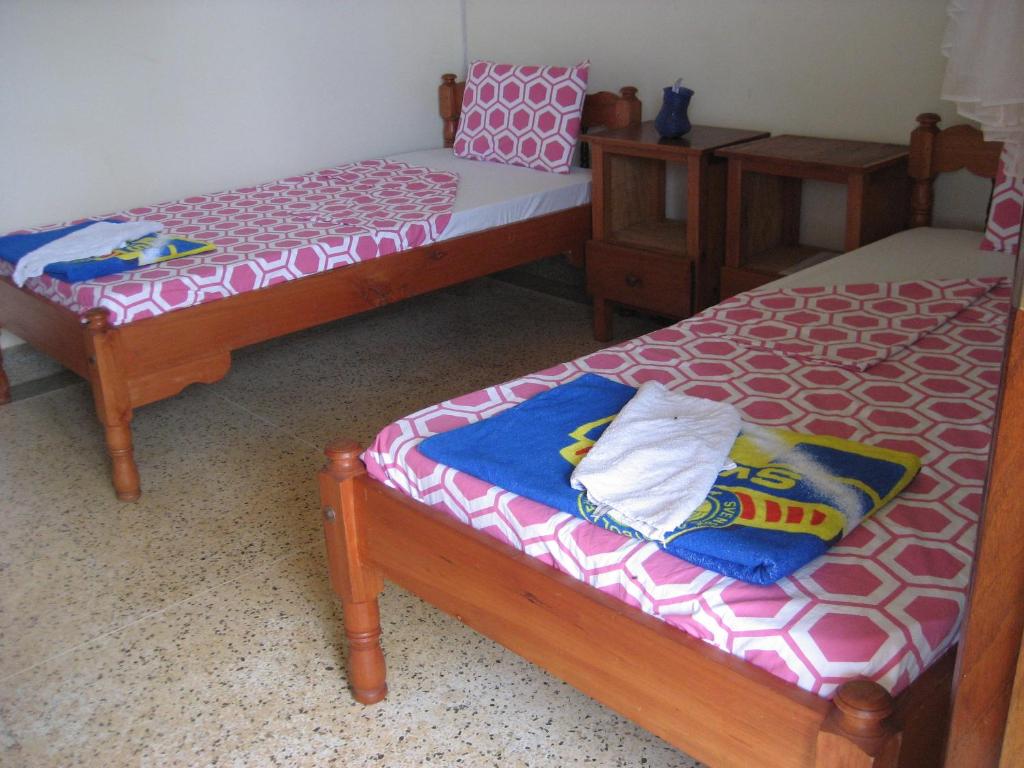 Postel nebo postele na pokoji v ubytování Voi Lutheran Guesthouse
