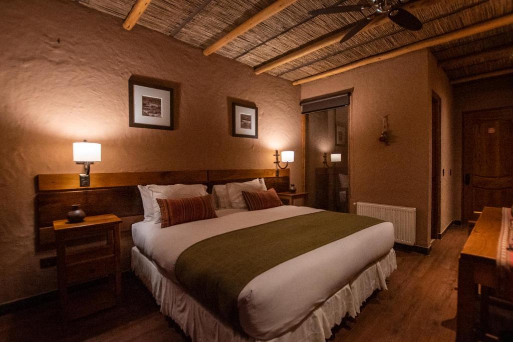 Postel nebo postele na pokoji v ubytování Hotel Pascual Andino